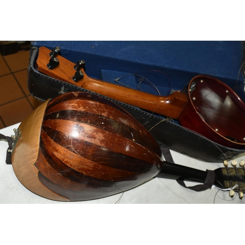 557 - A MANDOLIN AND BANJULELE BANJO, comprising mandolin with inlaid details and homemade shoulder strap ... 