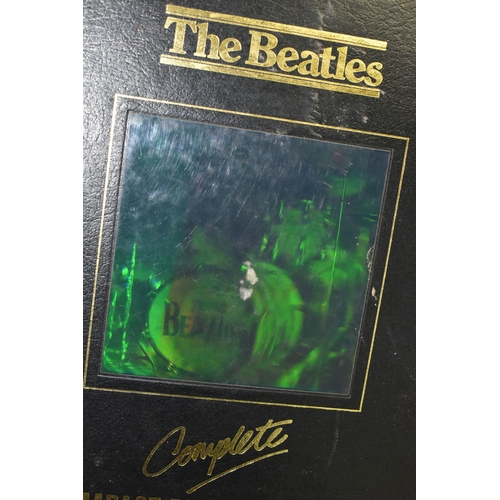 559 - A BOX OF 'THE BEATLES' BOOKS AND CDS, to include a boxed HMV The Beatles Complete Compact Disc Colle... 