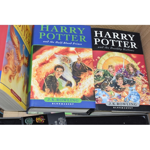 563 - HARRY POTTER, A Collection of paperback and hardback volumes of each book in the series (7) with two... 