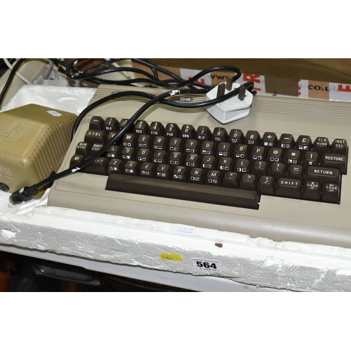 564 - COMMODORE 64 COMPUTER, doesn't include any video cables, however it does power on, together with an ... 