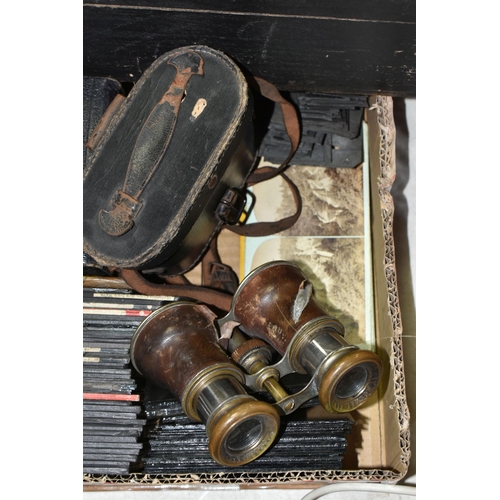 565 - A BOX OF LANTERN SLIDES AND BINOCULARS ETC, to include black & white photographic lantern slides dep... 