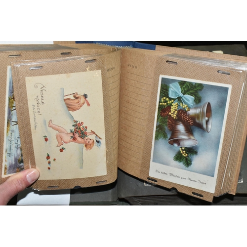 568 - TWO ALBUMS OF POSTCARDS containing approximately 405 miscellaneous examples, album one contains 104 ... 