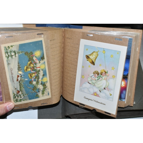 568 - TWO ALBUMS OF POSTCARDS containing approximately 405 miscellaneous examples, album one contains 104 ... 