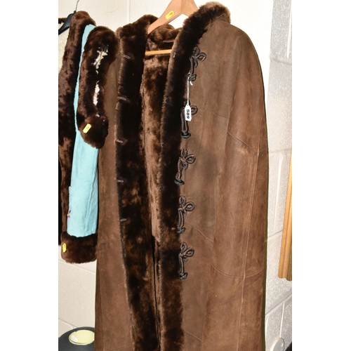 589 - TWO 1970S LADIES' SHEEPSKIN JACKETS, comprising a long brown hooded cape with covered buttons, Frogg... 