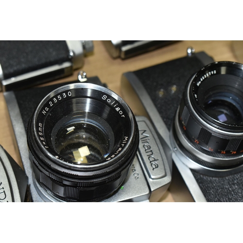 594 - A BOX OF TWELVE MIRANDA 35MM SLR CAMERA BODIES, together with eleven Miranda standard focal length l... 