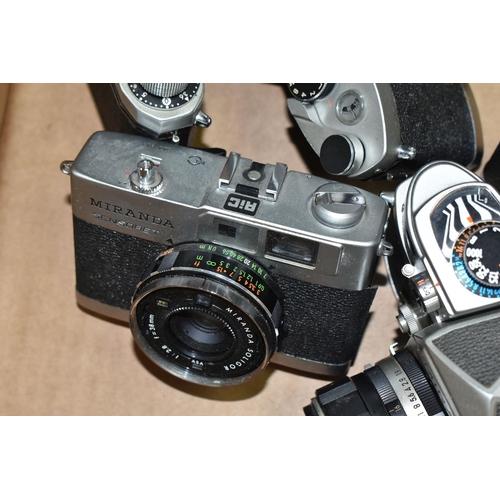 601 - SEVEN VINTAGE MIRANDA CAMERAS AND LENSES, comprising a ST body fitted with a 5cm f2.8 lens, an FV-T ... 