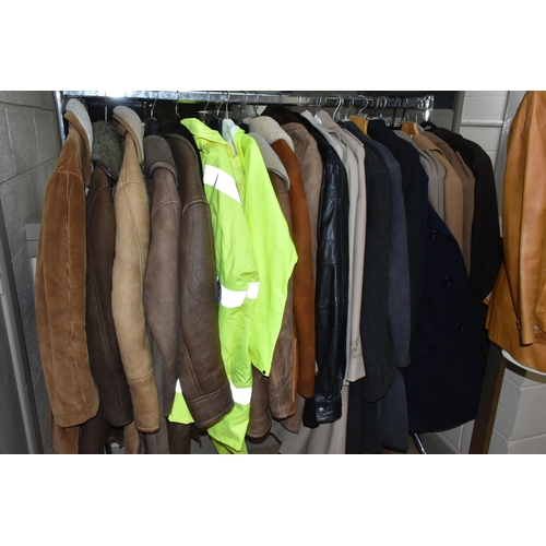 578 - A LARGE QUANTITY OF VINTAGE GENTLEMEN'S OVERCOATS AND JACKETS, to include a tan coloured 1970's leat... 