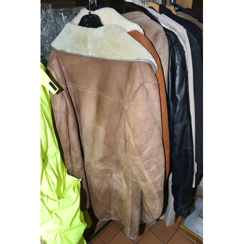 578 - A LARGE QUANTITY OF VINTAGE GENTLEMEN'S OVERCOATS AND JACKETS, to include a tan coloured 1970's leat... 