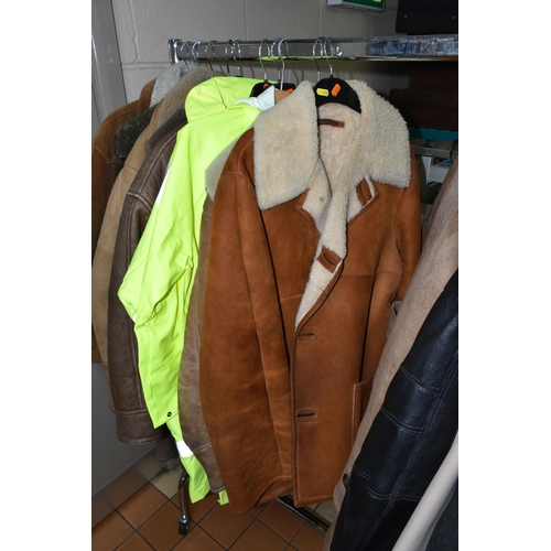 578 - A LARGE QUANTITY OF VINTAGE GENTLEMEN'S OVERCOATS AND JACKETS, to include a tan coloured 1970's leat... 