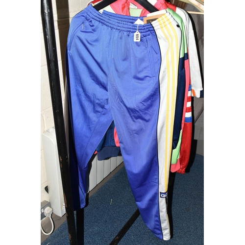 654 - FOUR 1980S TRACK SUITS AND A LUTON FOOTBALL TOP, comprising a new and unused Adidas blue, white and ... 