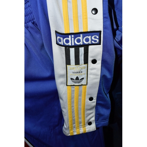 654 - FOUR 1980S TRACK SUITS AND A LUTON FOOTBALL TOP, comprising a new and unused Adidas blue, white and ... 