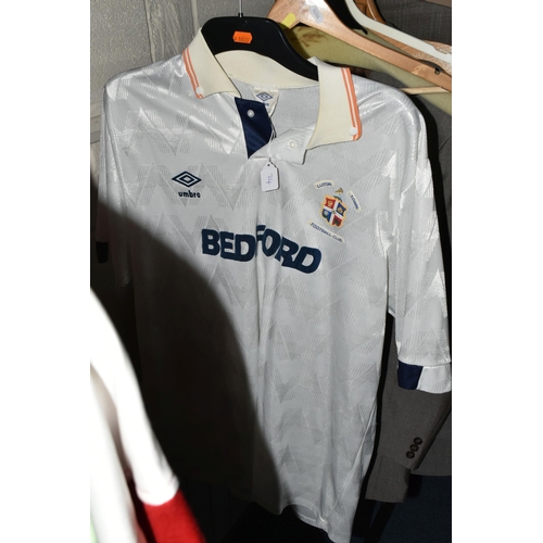 654 - FOUR 1980S TRACK SUITS AND A LUTON FOOTBALL TOP, comprising a new and unused Adidas blue, white and ... 