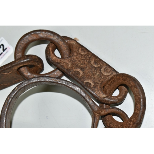 622 - 19TH CENTURY WROUGHT IRON SHACKLES, crude decoration to the flat links, lacking lock mechanism and k... 