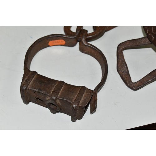 622 - 19TH CENTURY WROUGHT IRON SHACKLES, crude decoration to the flat links, lacking lock mechanism and k... 