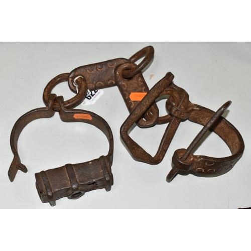 622 - 19TH CENTURY WROUGHT IRON SHACKLES, crude decoration to the flat links, lacking lock mechanism and k... 