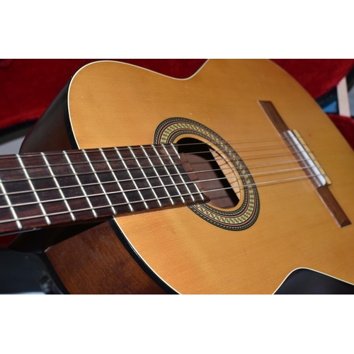 624 - AN ALPHA 200 MODEL SIX STRING ACOUSTIC GUITAR, natural finish to the top surface, together with a ha... 