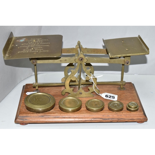 625 - A SET OF BRASS POSTAL SCALES, mounted on wooden plinth, no makers marks, complete with six brass wei... 