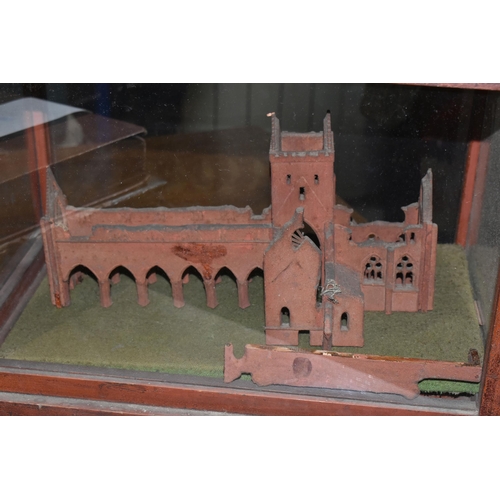 632 - A MODEL OF THE SWEET HEART ABBEY, New Abbey Dumfries in a wooden and glass glazed case, height 27cm ... 