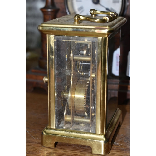 634 - TWO VINTAGE CLOCKS, comprising a brass Bayard 8 day carriage clock, in need of some attention and an... 