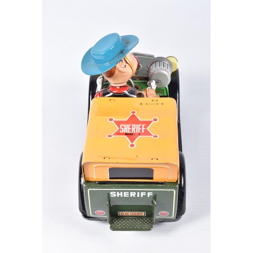 26 - A BOXED SHOWA TN TOYS TINPLATE BATTERY OPERATED SHERIFF CAR, not tested, appears complete and in goo... 