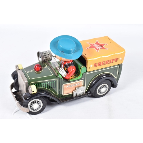 26 - A BOXED SHOWA TN TOYS TINPLATE BATTERY OPERATED SHERIFF CAR, not tested, appears complete and in goo... 