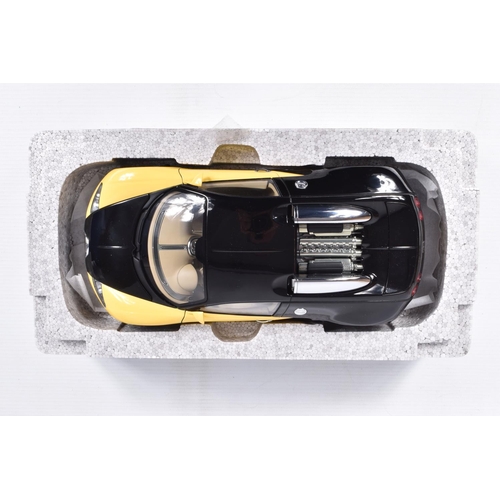 68 - A BOXED DIECAST MODEL 1:18 SCALE BUGATTI EB 16.4 VEYRON SHOWCAR, numbered 70904, in black and yellow... 