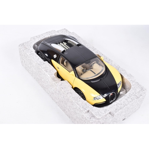 68 - A BOXED DIECAST MODEL 1:18 SCALE BUGATTI EB 16.4 VEYRON SHOWCAR, numbered 70904, in black and yellow... 