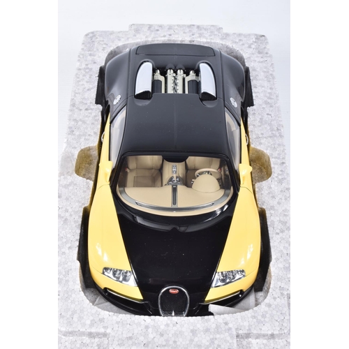 68 - A BOXED DIECAST MODEL 1:18 SCALE BUGATTI EB 16.4 VEYRON SHOWCAR, numbered 70904, in black and yellow... 