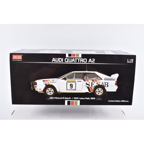 114 - TWO BOXED SUN STAR 1:18 SCALE DIECAST MODEL CARS,  to include an Audi Quattro A2, no. 9, 1000 Lakes ... 