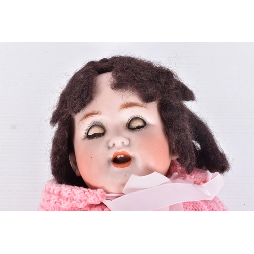 74 - A BISQUE HEAD DOLL, nape of neck marked 'Germany', wig stuck over any other marking, sleeping blue g... 