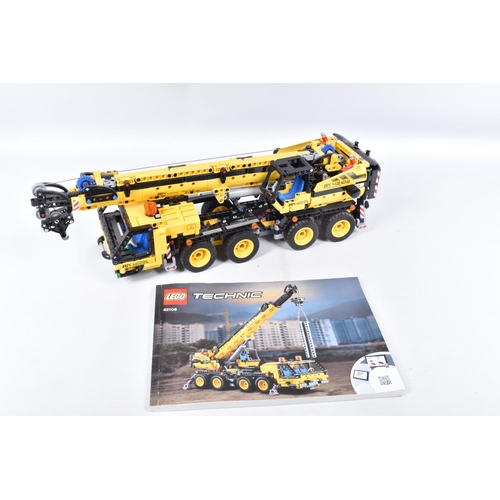 82 - A COLLECTION OF BUILT LEGO, to include a Lego technic Mobile Crane, number 42108, with booklet no bo... 