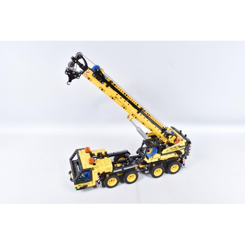 82 - A COLLECTION OF BUILT LEGO, to include a Lego technic Mobile Crane, number 42108, with booklet no bo... 