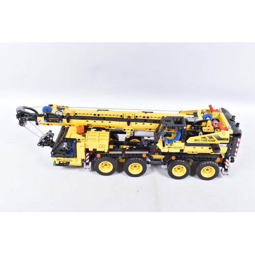 82 - A COLLECTION OF BUILT LEGO, to include a Lego technic Mobile Crane, number 42108, with booklet no bo... 