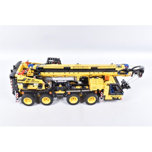 82 - A COLLECTION OF BUILT LEGO, to include a Lego technic Mobile Crane, number 42108, with booklet no bo... 