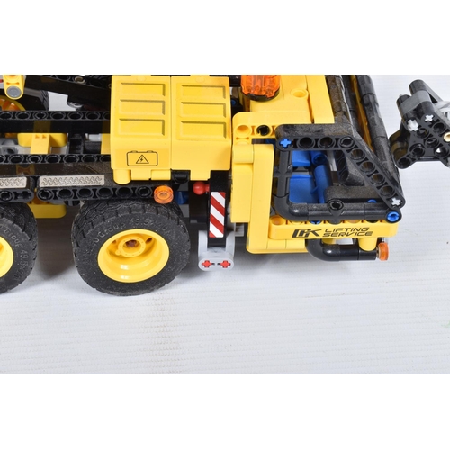 82 - A COLLECTION OF BUILT LEGO, to include a Lego technic Mobile Crane, number 42108, with booklet no bo... 