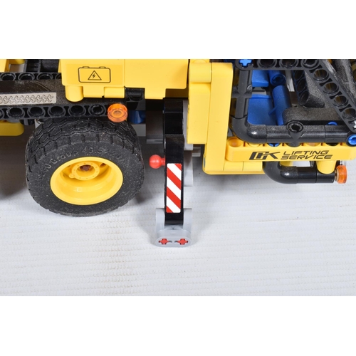 82 - A COLLECTION OF BUILT LEGO, to include a Lego technic Mobile Crane, number 42108, with booklet no bo... 