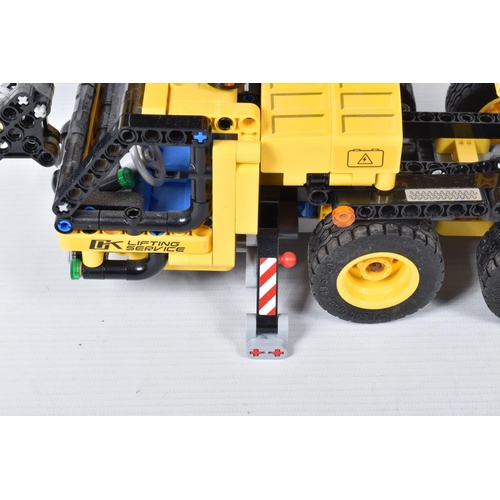 82 - A COLLECTION OF BUILT LEGO, to include a Lego technic Mobile Crane, number 42108, with booklet no bo... 