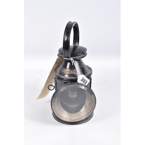 303 - AN L.M.S. RAILWAY THREE ASPECT HAND LAMP, complete with reservoir and burner (both stamped L.M.S.)an... 