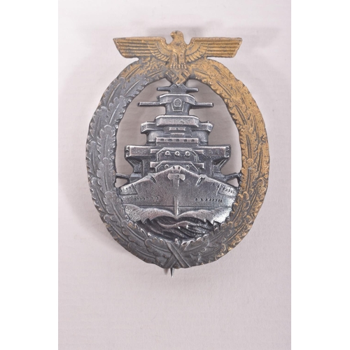 351 - A GERMAN KRIEGSMARINE HIGH SEAS FLEET BADGE AND STICK PIN, the badge has lost some of its finish to ... 