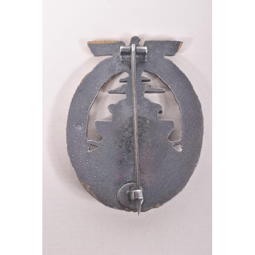 351 - A GERMAN KRIEGSMARINE HIGH SEAS FLEET BADGE AND STICK PIN, the badge has lost some of its finish to ... 