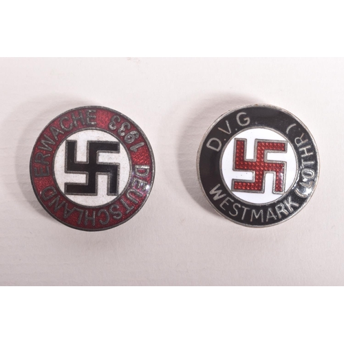 352 - TWO GERMAN 1930S OR LATER PIN BADGES, to include a DVG badge and a 1933 badge, the first has black, ... 