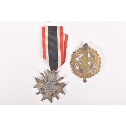 354 - A GERMAN SA SPORTS BADGE AND A WAR MERIT CROSS WITH SWORDS, the SA badge is 1st pattern and was prod... 