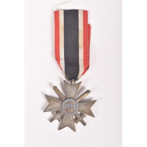 354 - A GERMAN SA SPORTS BADGE AND A WAR MERIT CROSS WITH SWORDS, the SA badge is 1st pattern and was prod... 