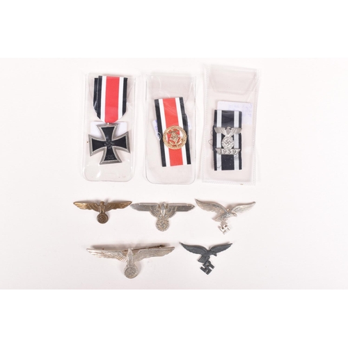 373 - AN ASSORTMENT OF GERMAN METAL CAP EAGLES AND IRON CROSS AWARDS, the cap eagles consist of four small... 