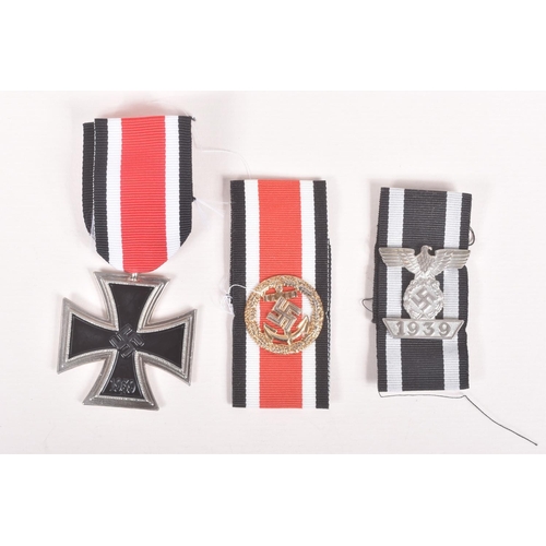 373 - AN ASSORTMENT OF GERMAN METAL CAP EAGLES AND IRON CROSS AWARDS, the cap eagles consist of four small... 