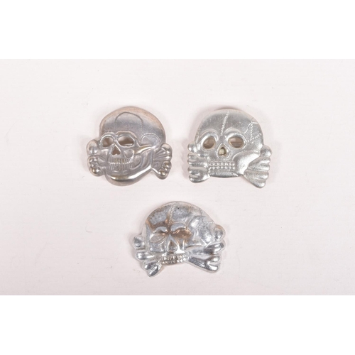 375 - THREE GERMAN VISOR CAP SKULLS FROM VARIOUS YEARS, only one is maker marked with RZM M1/S2, we believ... 