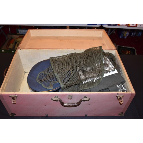 466 - A MILITARY STYLE TRUNK CONTAINING A RANGE OF UNIFORMS FROM VARIOUS ERAS AND COUNTRIES, this lot incl... 