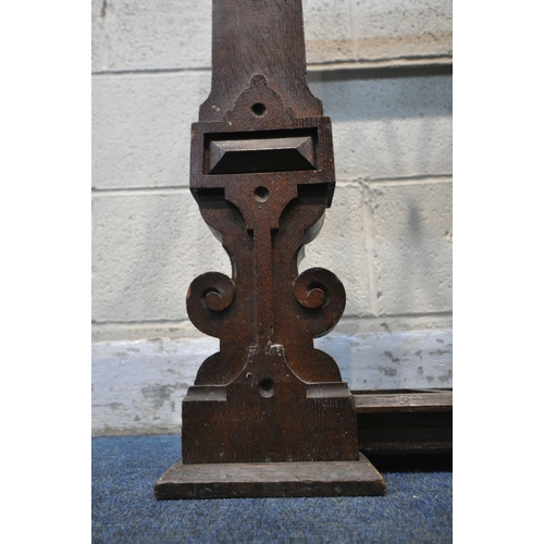 1234 - A 20TH CENTURY OAK GOTHIC STYLE STICK STAND, with three divisions, geometric and scrolled carved des... 