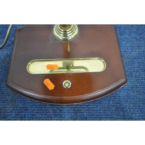 1249 - A BRASS BANKERS LAMP, with a green adjustable shade, on a wooden base fitted with a pen tray