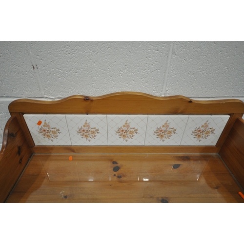 1250 - A MODERN PINE WASH STAND, with a raised tiled back, a glass surface protector, a single dummy drawer... 